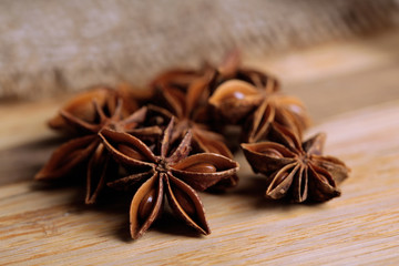 Star anise on wooden background