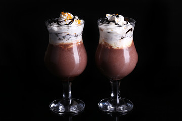 Tasty dessert with chocolate, cream and orange sauce, isolated