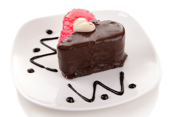 Sweet cake with chocolate on plate isolated on white