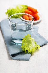 Healthy food - water, carrot and lettuce