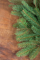 frame from branch of Christmas tree on old wood close up