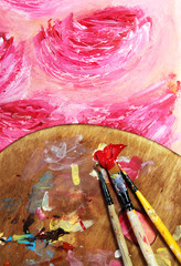 Paintbrush and beautiful painting with flowers