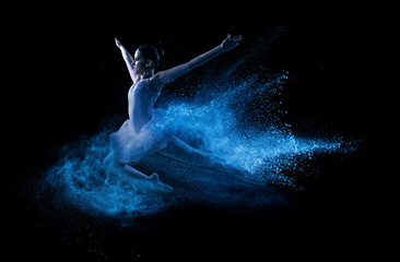 Young beautiful dancer jumping into blue powder cloud - 59438252