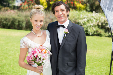 Attractive newlyweds looking at the camera