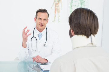 Doctor in communication with patient at medical office