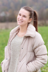 Obraz premium Teenage girl standing on the meadow