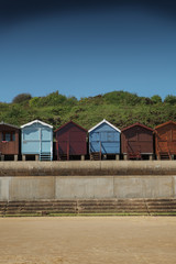 Fototapeta na wymiar Beach Huts on the seashore, Frinton, England