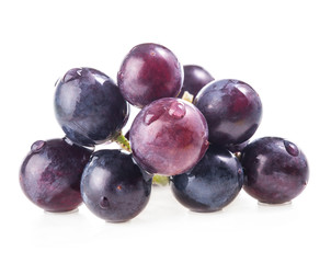 Ripe grapes with water drops. Isolated on white