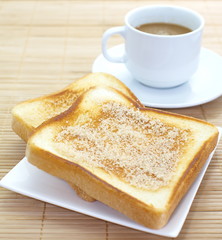 Slice of grilled bread and coffee