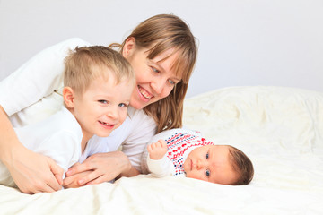 happy mother with two kids enjoying time together