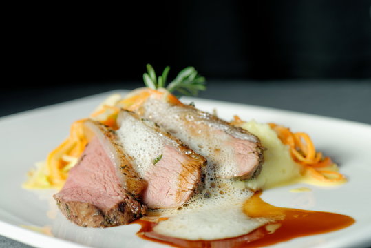 Roast of veal with potatoes and vegetables