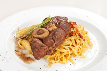 tasty steak with pasta