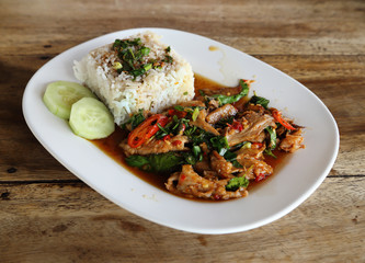 Fried pork with sweet basi and white jasmine sticky rice