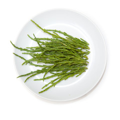 Plate of Samphire isolated on a white studio background.