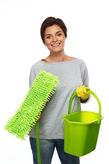 Beautiful cheerful brunette woman in gloves with mop and bucket