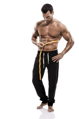 Fototapeta premium Muscle man taking is measures