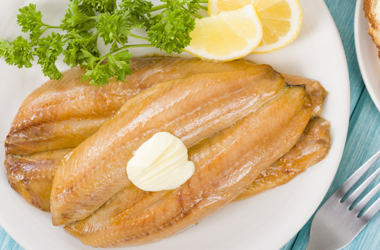 Smoked Kippers - Butterfly smoked herring served with bread.