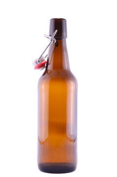 Old brown bottle of beer isolated on white