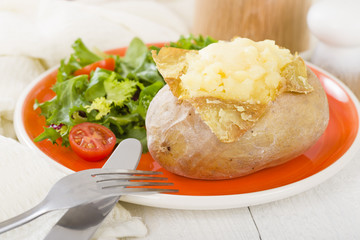 Jacket Potato - Baked potato with cheese served with salad.