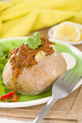 Jacket Potato - Baked potato topped with chilli con carne.