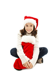 Little girl with Christmas gift on white background