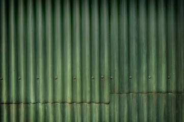 Green multi-tone grunge corrugated wall with character