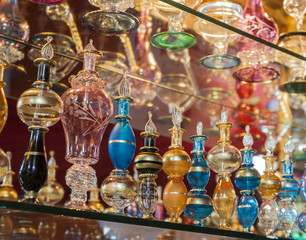Fototapeta na wymiar Ornate perfume bottles on a shelf