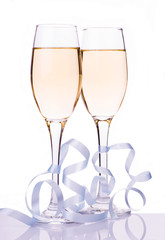 two champagne glasses over white background