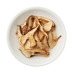 Dried shiitake mushroom slices in a bowl isolated on white backg