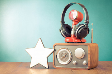 Retro radio, red microphone, headphones and win star