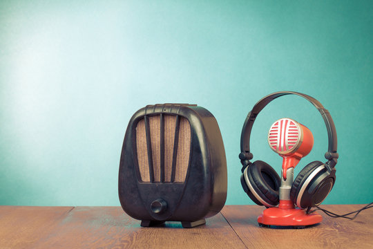 Retro radio, red microphone and headphones old style photo