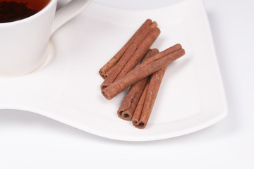 Cinnamon sticks on a saucer