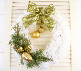 Christmas wreath on wooden background