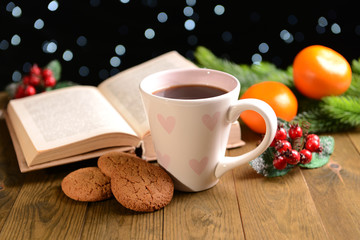 Composition of book with cup of coffee and Christmas
