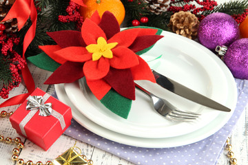 Christmas table setting with festive decorations close up
