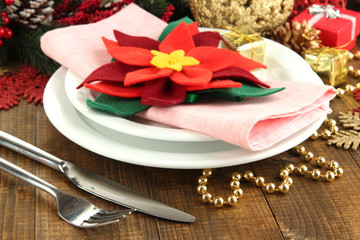 Christmas table setting with festive decorations close up
