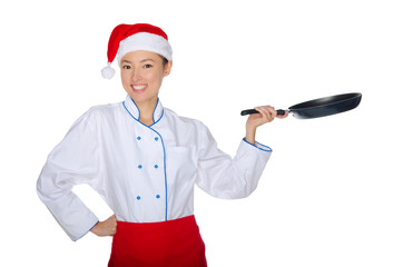 East chef with frying pan