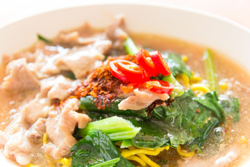 Fried noodle with pork, squid and shrimp soaked in gravy, Chines