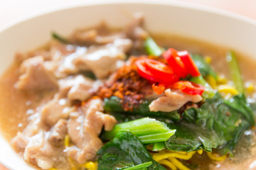 Fried noodle with pork, squid and shrimp soaked in gravy, Chines