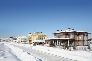 Street in small cottage settlements in winter frosty and sunny
