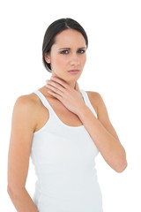 Portrait of a casual woman suffering from neck ache