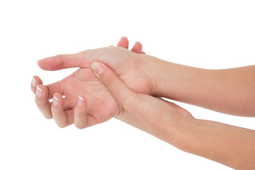 Close-up of a young woman touching her wrist
