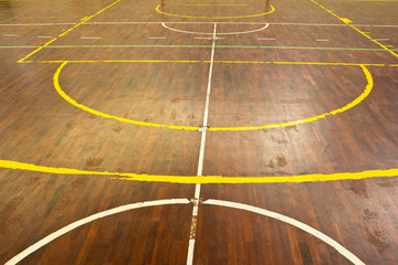 Wooden floor of sports hall with marking lines