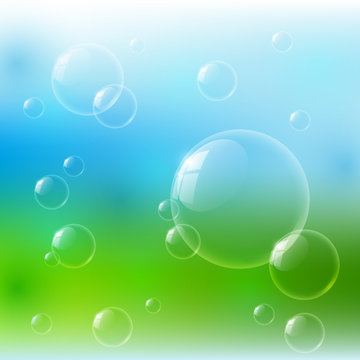 Glossy bubbles on nature background