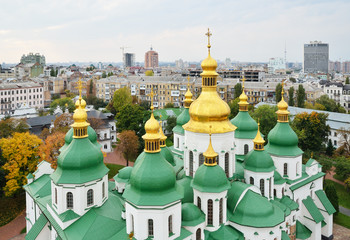 Ancient cathedral against the modern city Kyiv