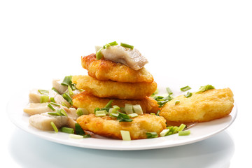 potato pancakes with herring and onion