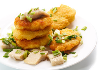 potato pancakes with herring and onion