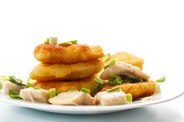 potato pancakes with herring and onion