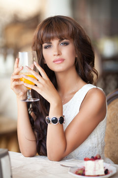 beautiful woman in cafe restaurant summer lifestyle portrait