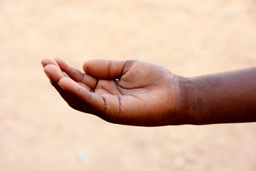 Child begging hand closeup